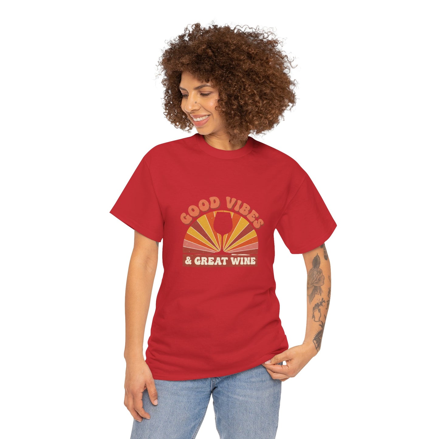 Person wearing red T-shirt with a vintage graphic that states "good vibes and great wine" and white background