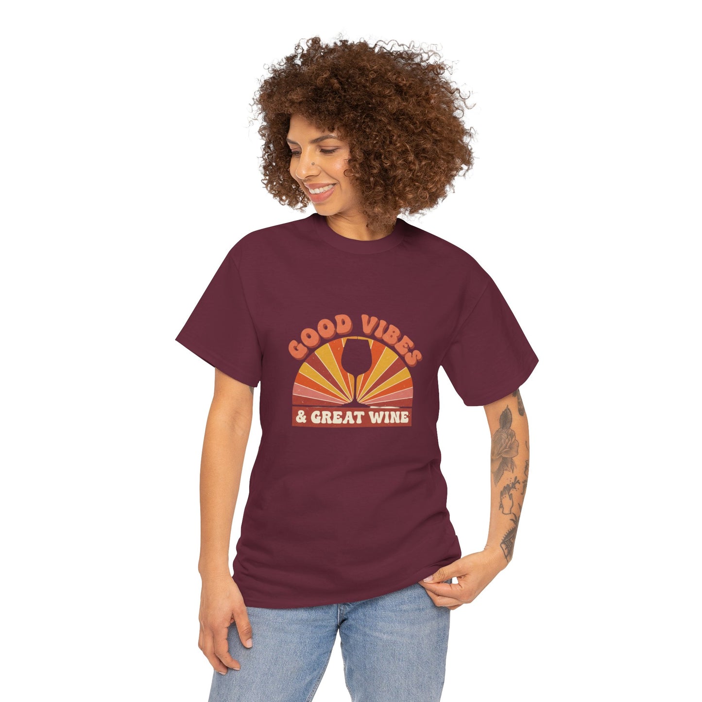 Woman wearing maroon shirt that states Good Vibes and Great Wine with a vintage style graphic with white background. #winelover #girlstrip #winehumor